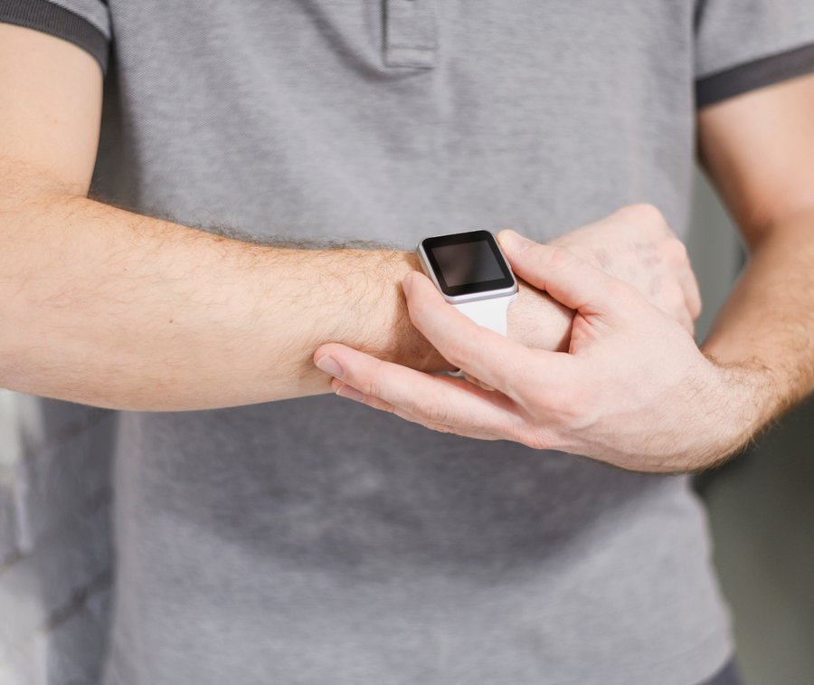 close-up-entrepreneur-holding-smart-watch.jpg