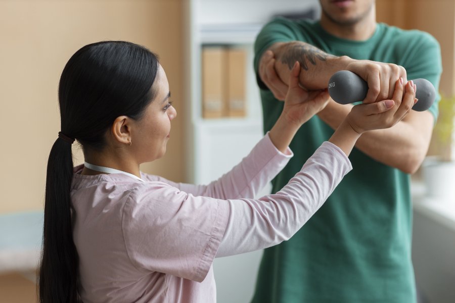 doctor-helping-patient-rehabilitation-1-.jpg